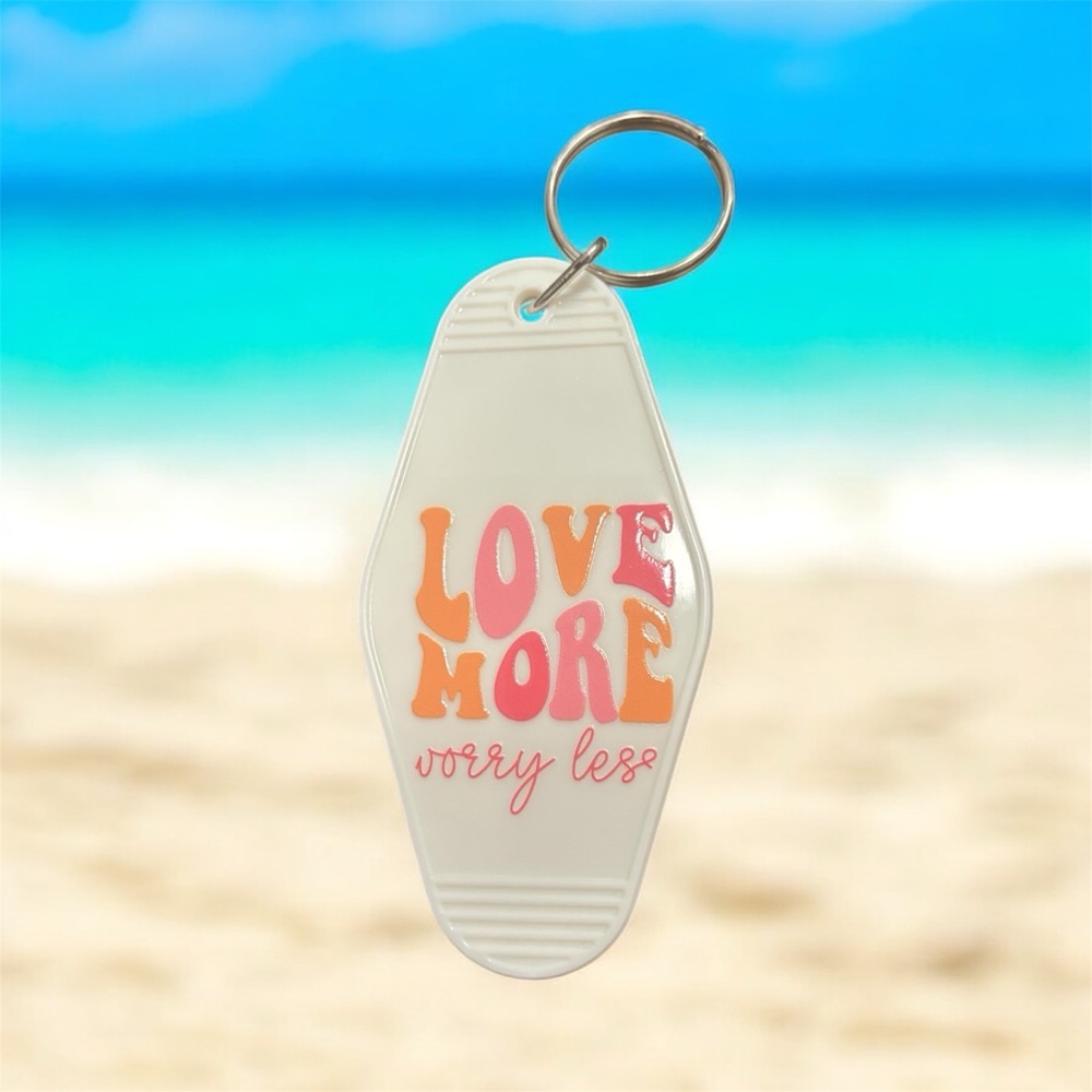 White Keychain with Colorful Text